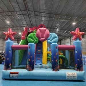 Large Ocean-themed inflatable obstacle course combo with dual-lane slide